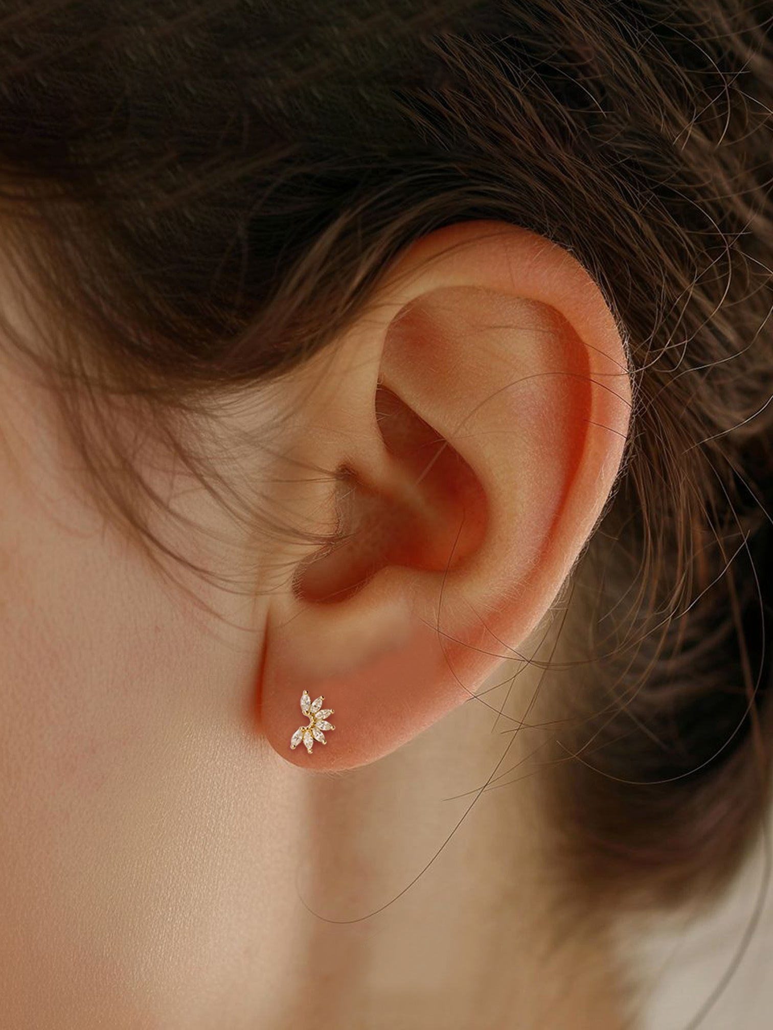 Model wearing Winter Stud Earrings with cubic zirconia frost petals in 18K gold over sterling silver.