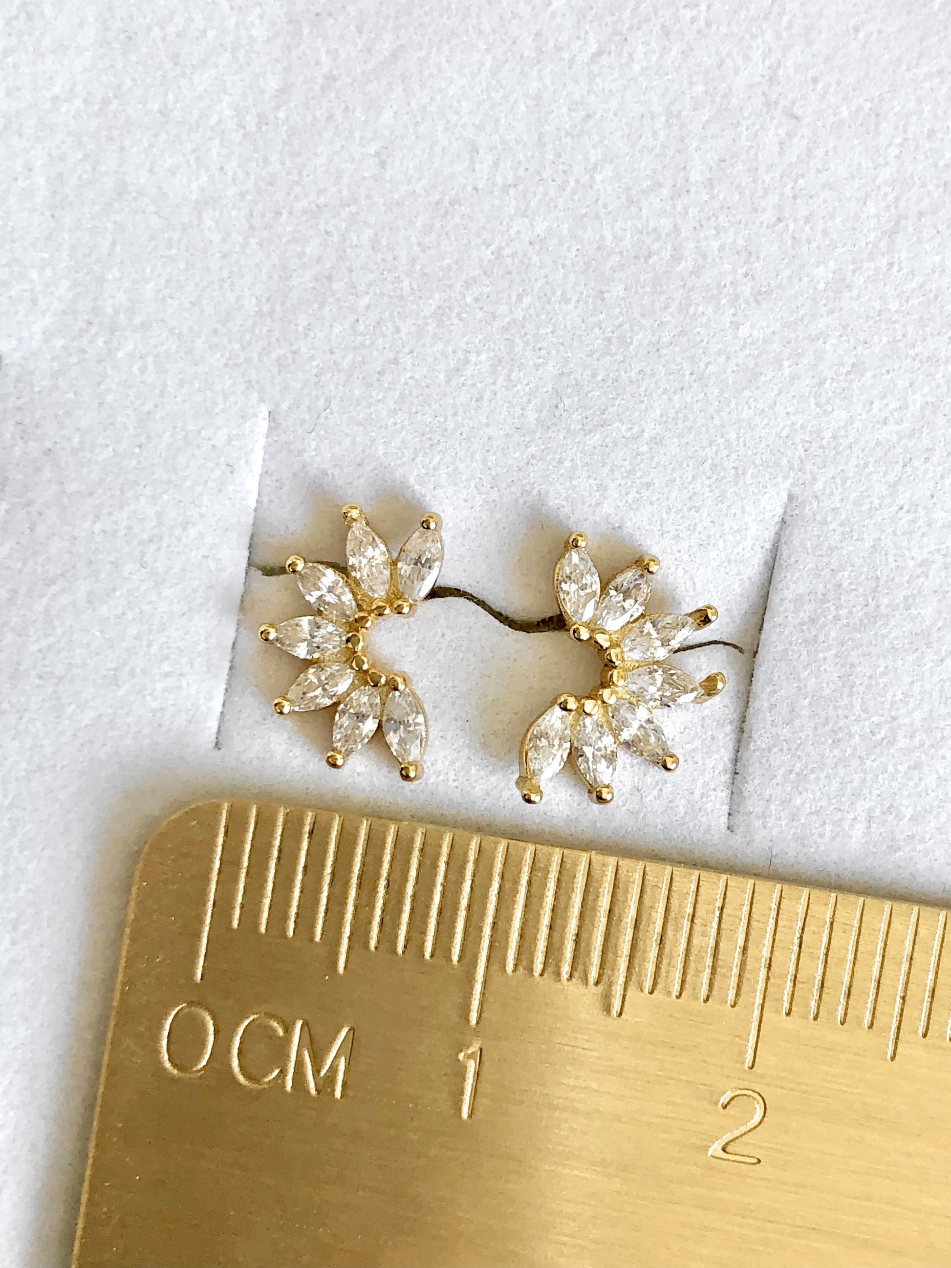 Winter Stud Earrings measured with gold ruler, showing 10mm x 6mm size in 18K gold over sterling silver.
