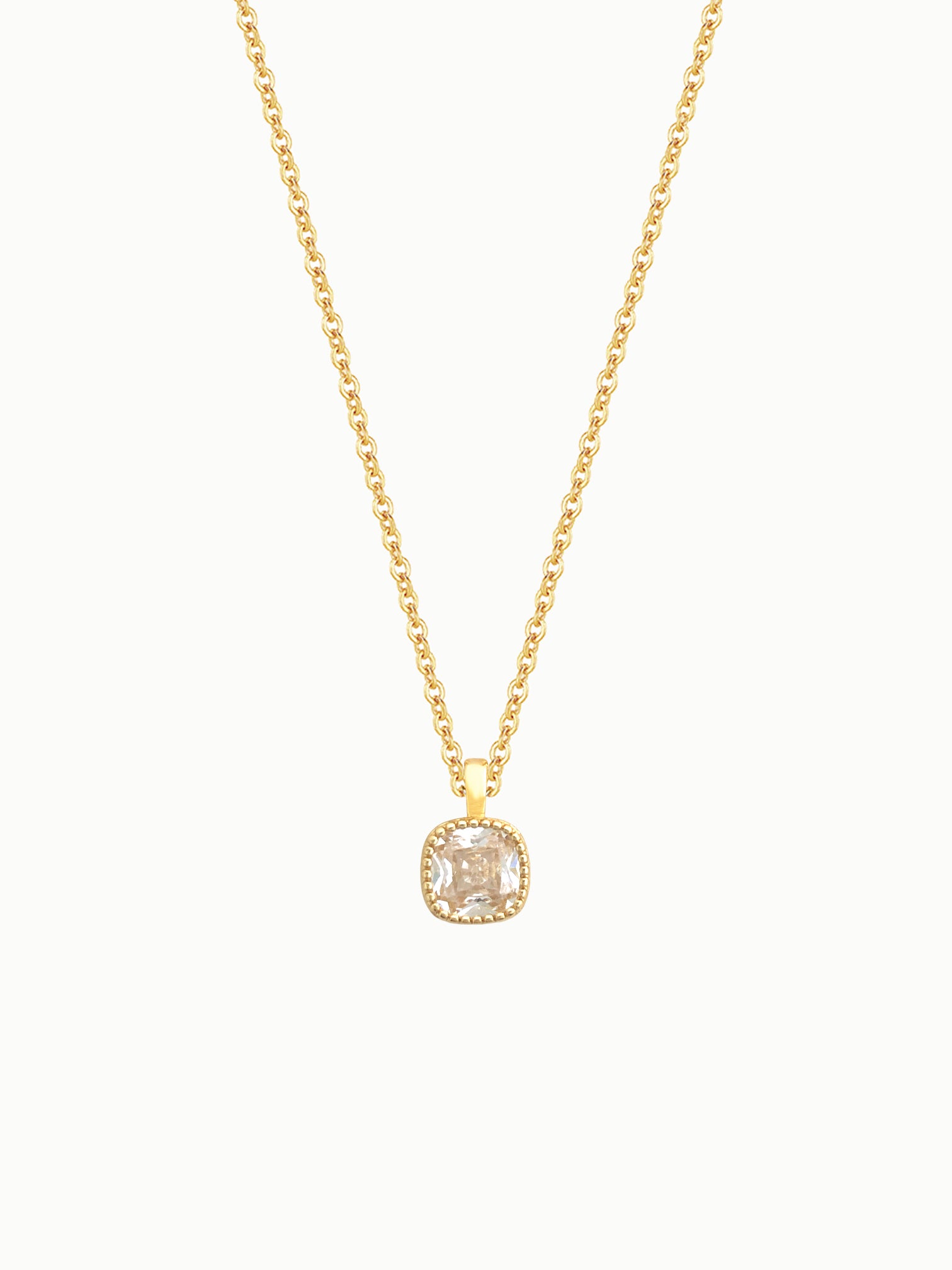 FAVES Gemma necklace with cushion-cut clear cubic zirconia pendant, 18K gold layered brass chain.