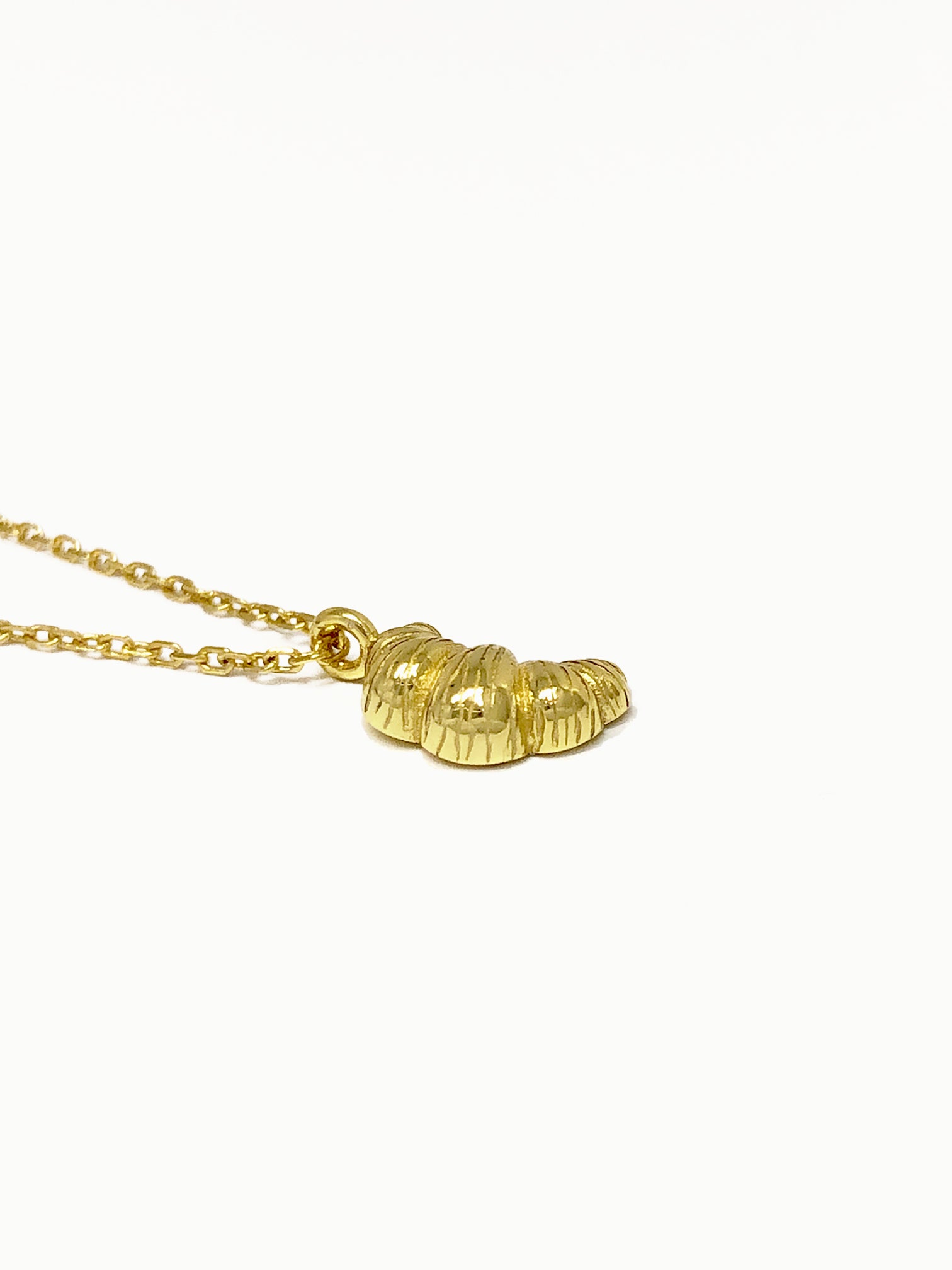 FAVES Croissant Necklace pendant close-up – 18K gold plated sterling silver croissant charm with sculptural texture, hypoallergenic, tarnish-resistant