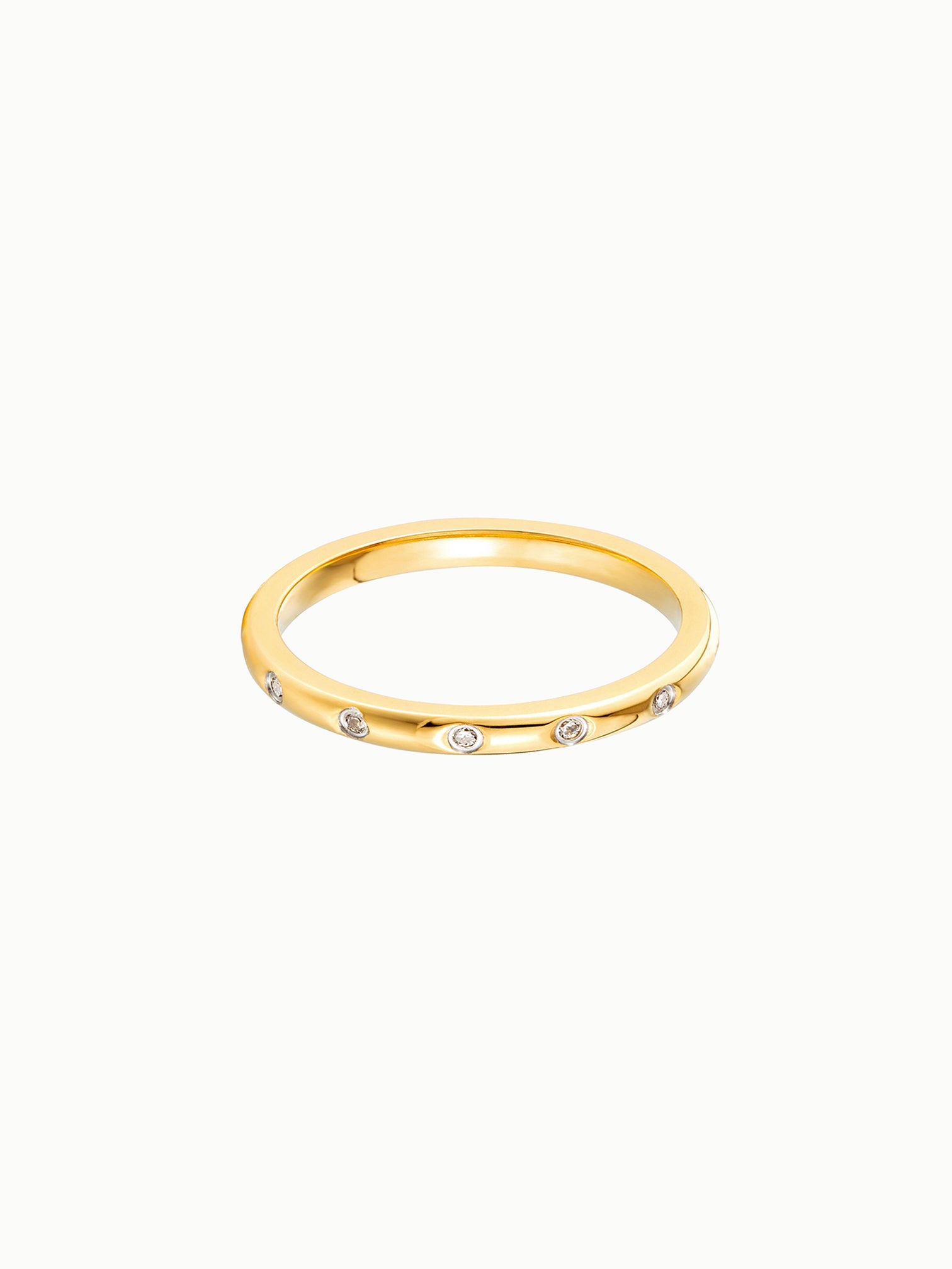 FAVES Lyra eternity ring – slim 18K gold plated titanium band with cubic zirconia stones set around entire ring